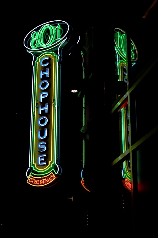 the po is taken outside of a building with neon lights