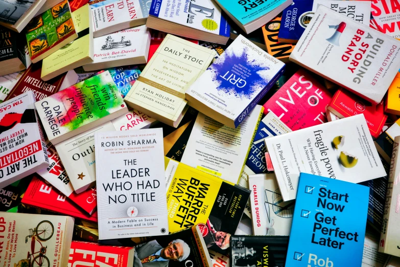 many different types of books scattered together