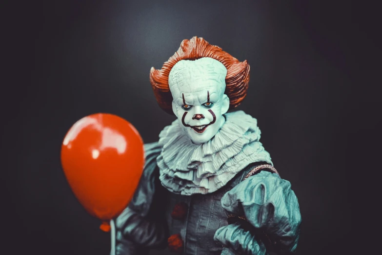 a penny penny penny doll holding a balloon