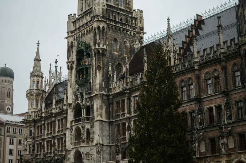 an ornate building in a european city has christmas decorations