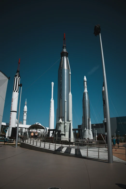 multiple rockets are lined up in front of a building