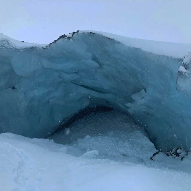 the snowy landscape has ice formations on it