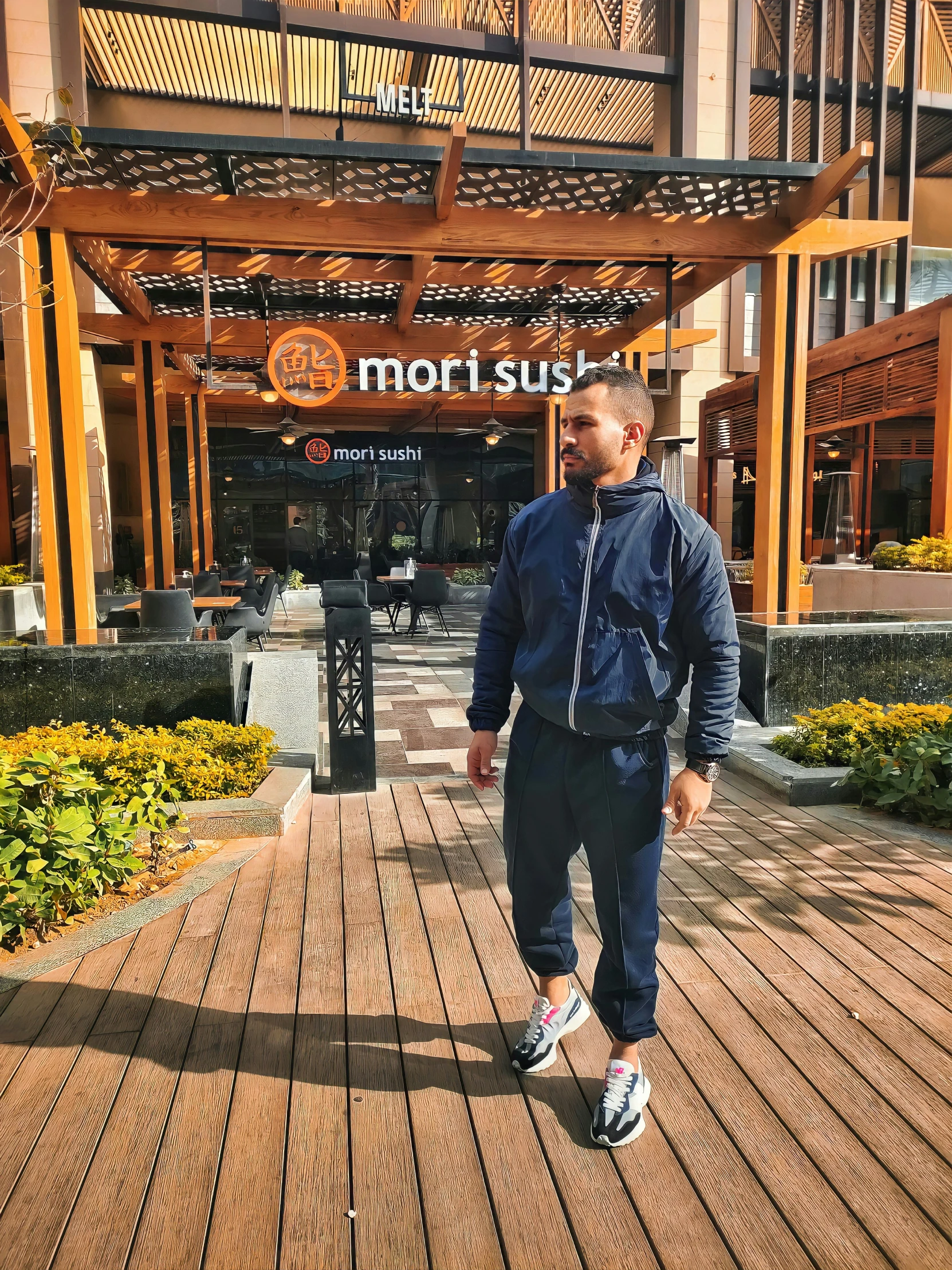 a man that is standing on some wood floor