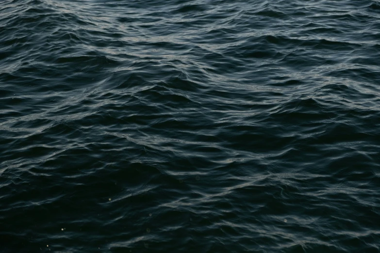 a boat on the ocean in a hazy weather