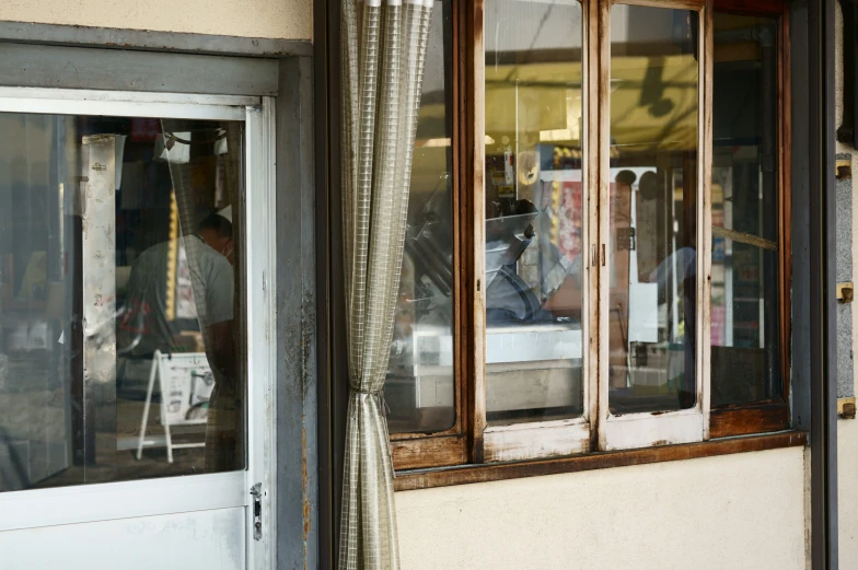 this is the reflection of a person inside of a window