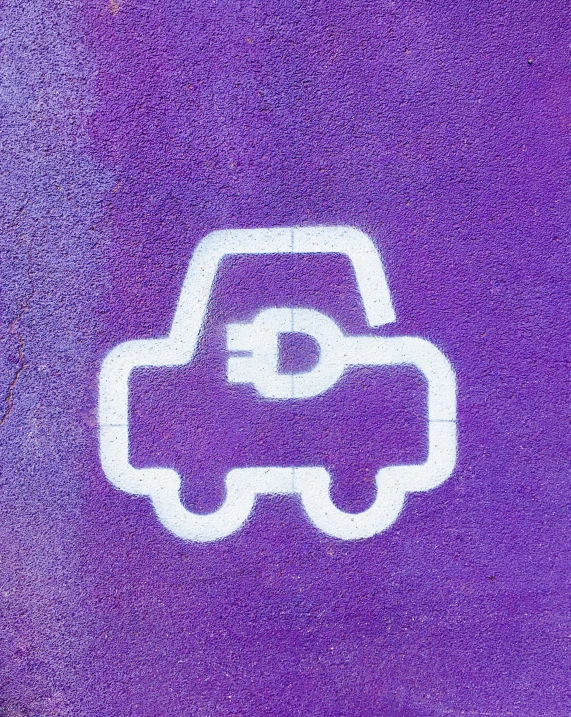 a car logo is on a parking space