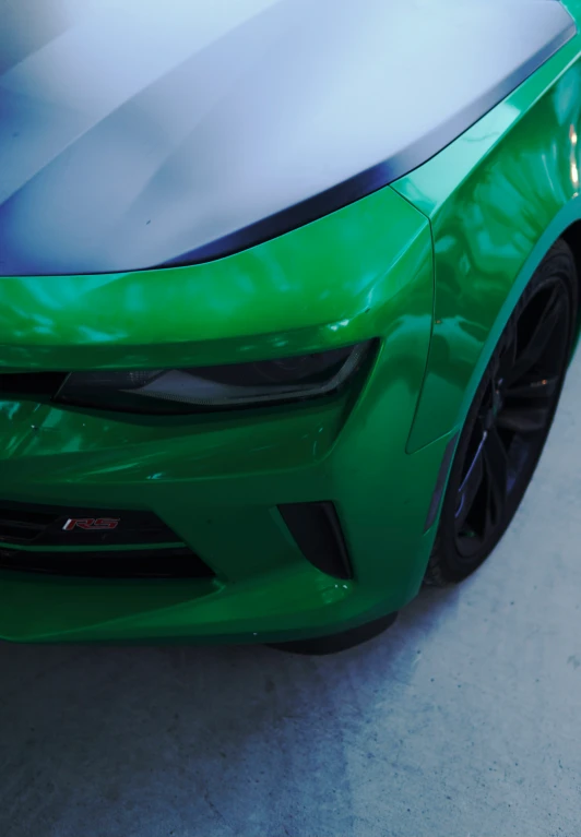 the front bumper is painted in green with silver accents