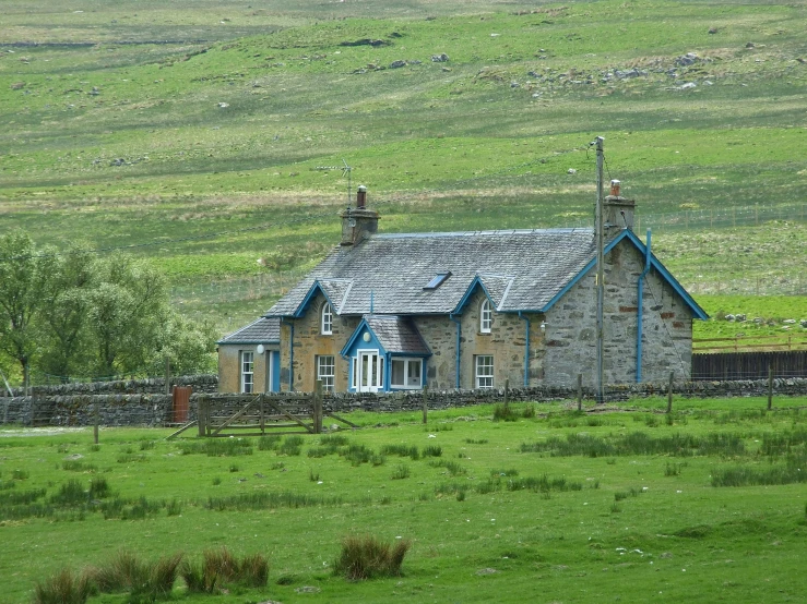 this is a picture of a stone house in the country