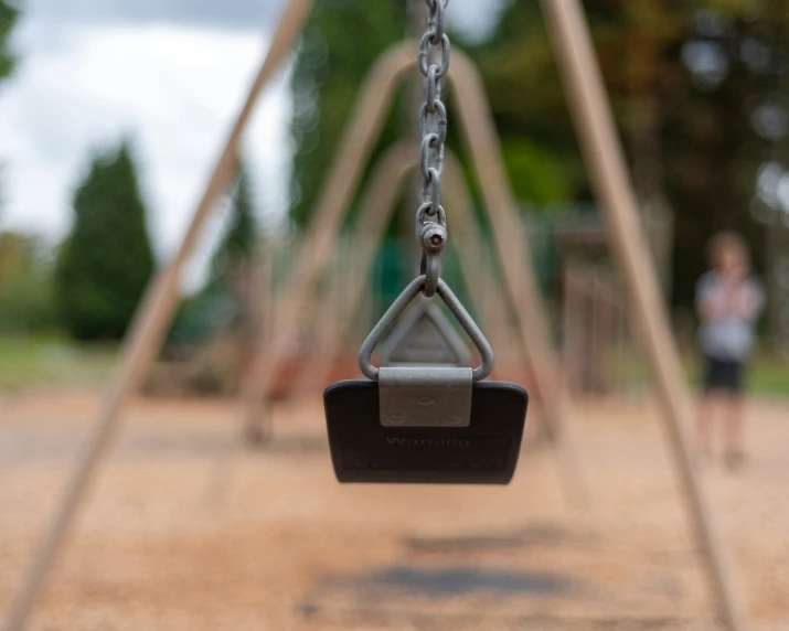 two children play swings are placed on a playground