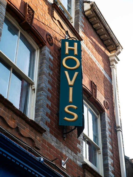 a sign on a building that says hol o s