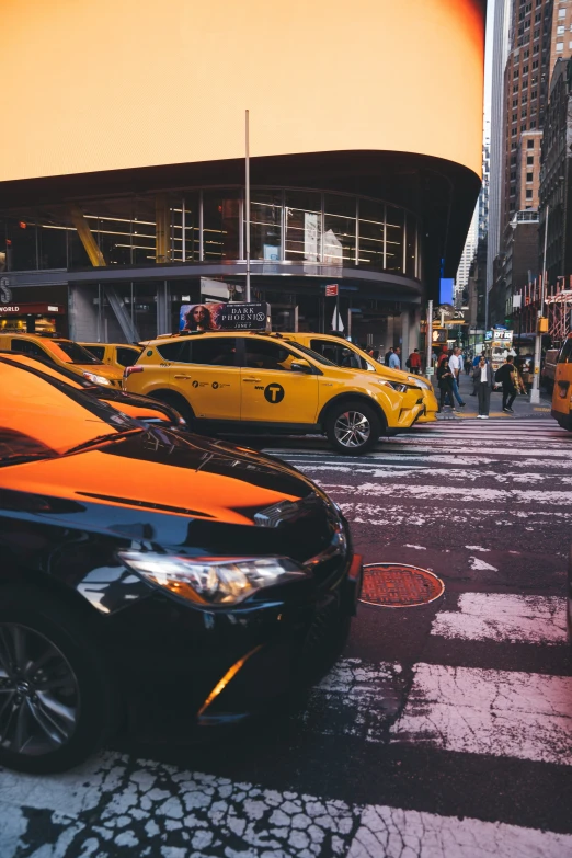 a street filled with parked cars on top of a city street