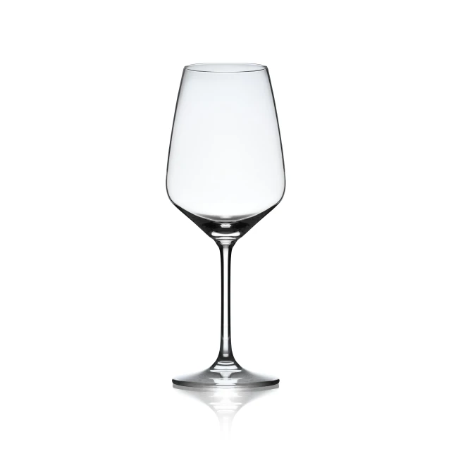 an empty wine glass sitting on top of a table