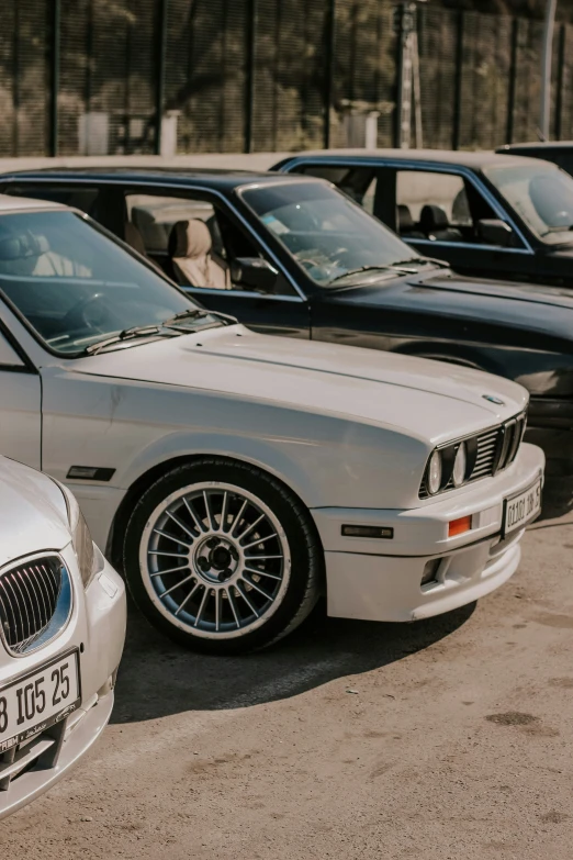 there are many parked bmws in this parking lot