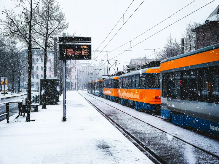 a train sitting on tracks covered in snow