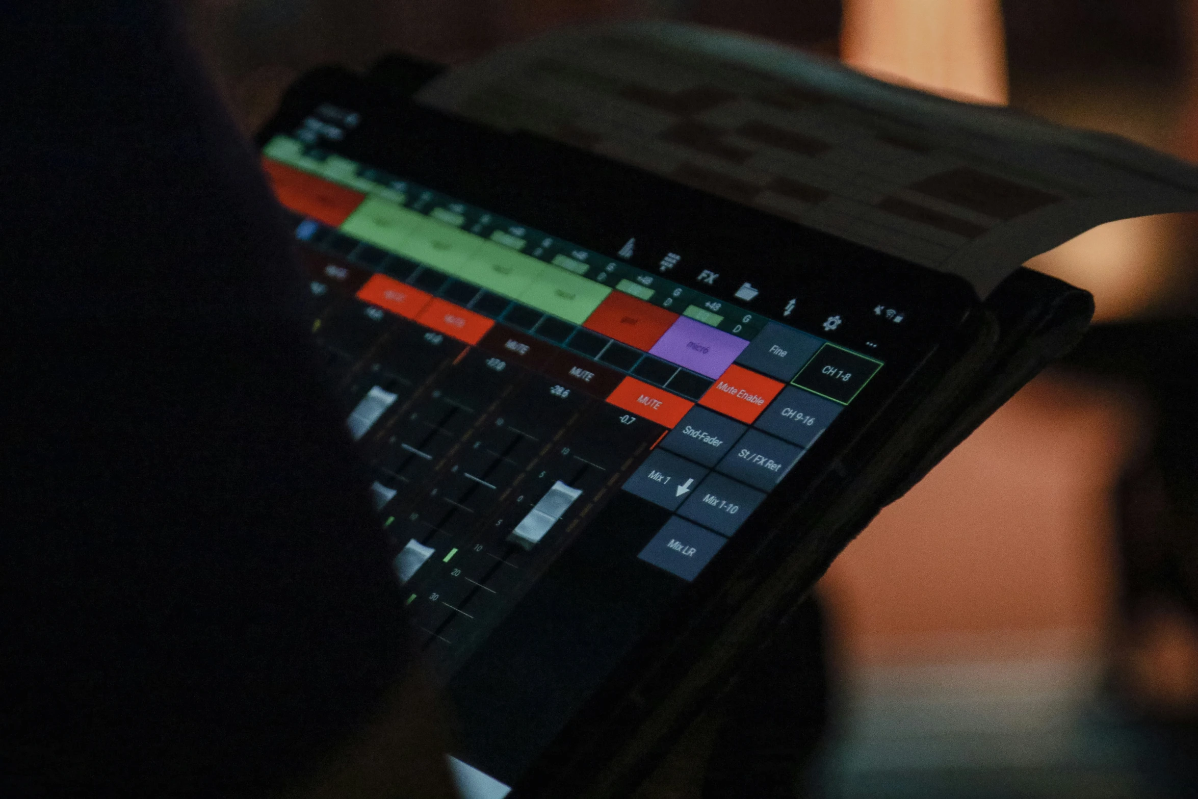 a close up s of someones hand using a tablet with a keyboard and a mouse