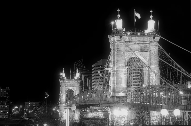 a night view of a large bridge lit up