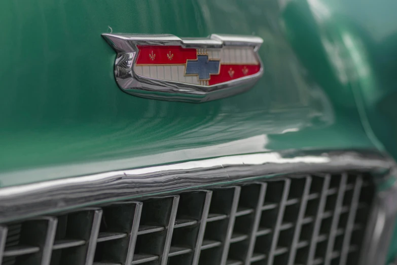 a green chevy emblem on a green car