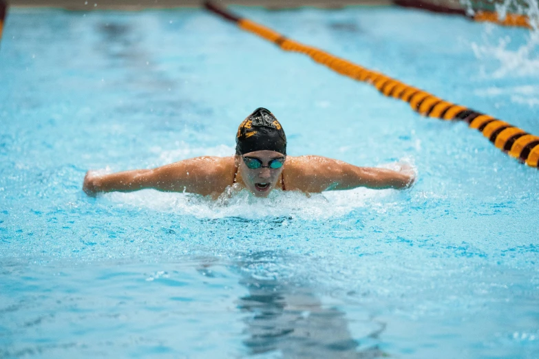 a swimming pool with swimmers in it