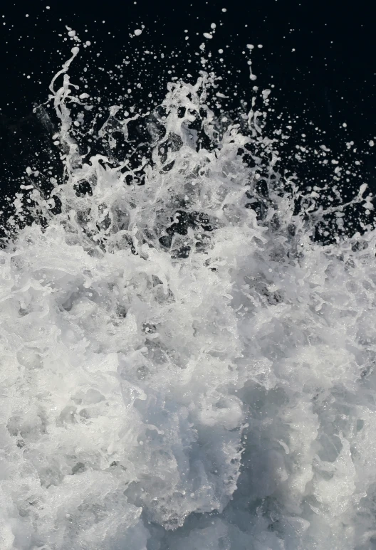 water gushing up into the air from a wake board