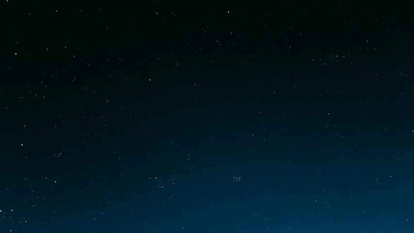 stars on a dark blue night sky as seen from below