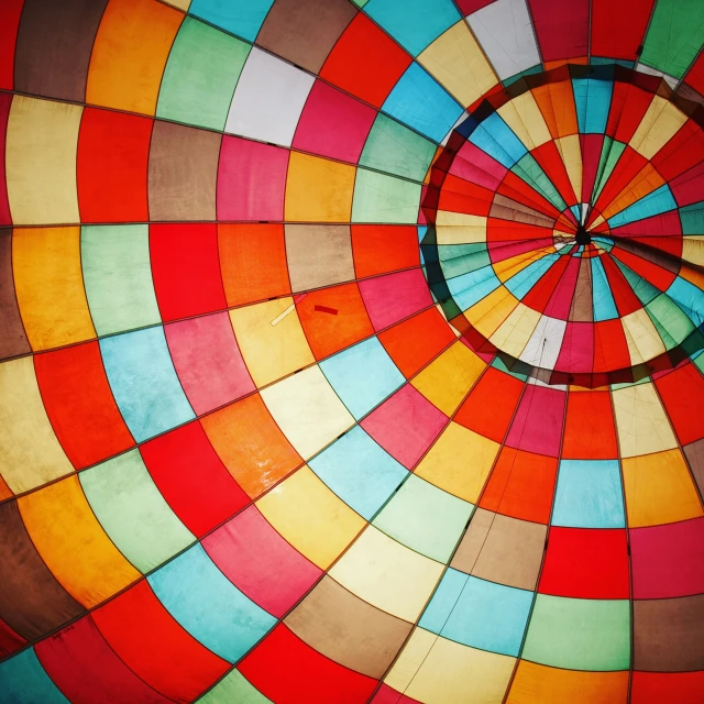 a large colorful  air balloon with the middle section showing an odd shape
