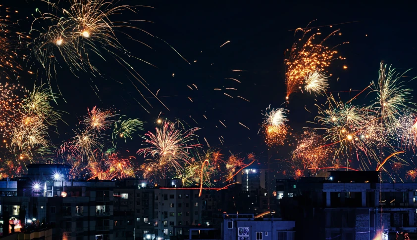 fireworks lit up the night sky above the city