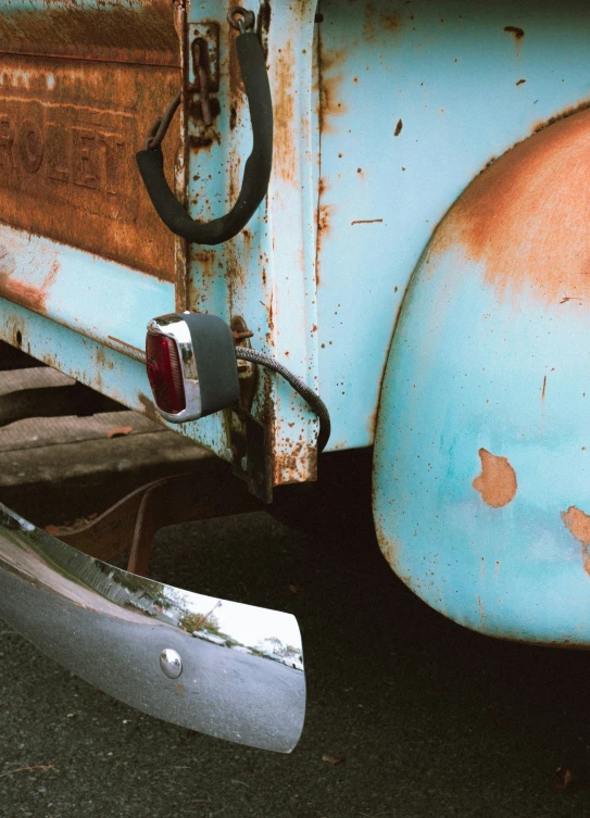 the old rusted door handle on an old and rusty pickup truck