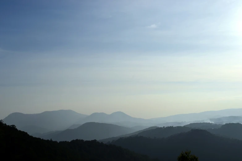 a view of some hills from the top of a hill