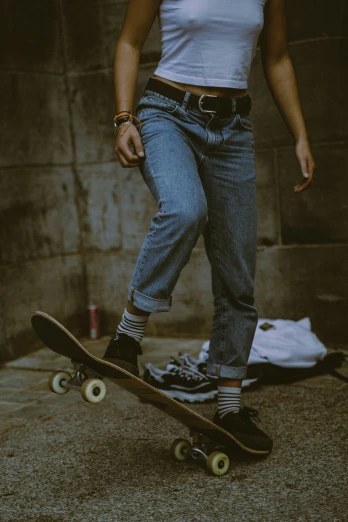 a person standing on a skate board in the street