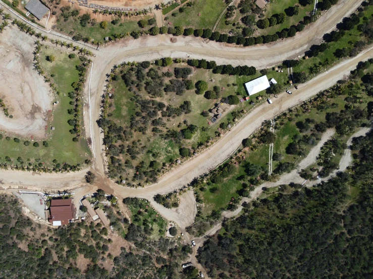 an aerial view of a road in the hills
