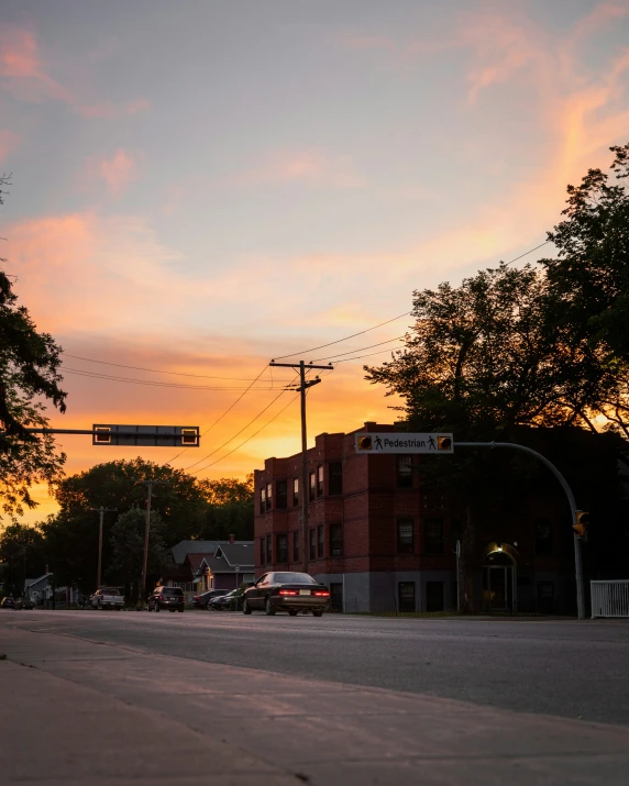 a sunset view with a street and traffic lights