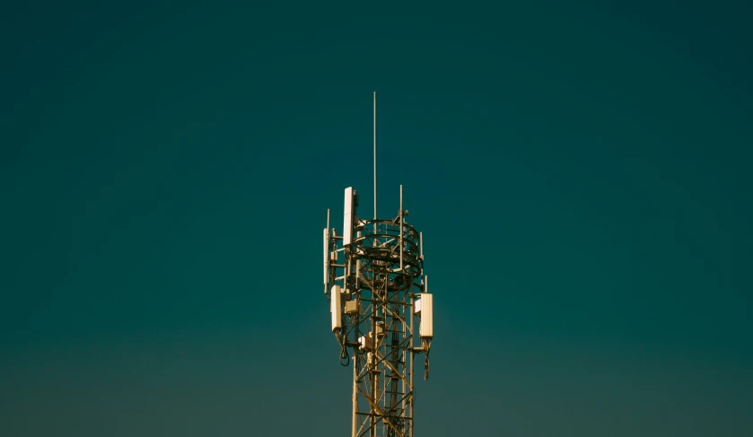 a tower that is made of steel with many wires attached to it