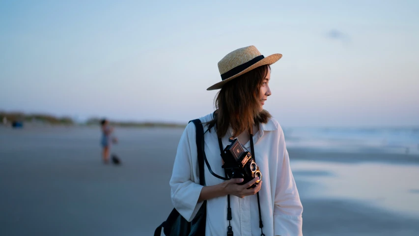 a person that is on the beach with a camera