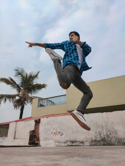 a young man jumping on his skateboard in the air