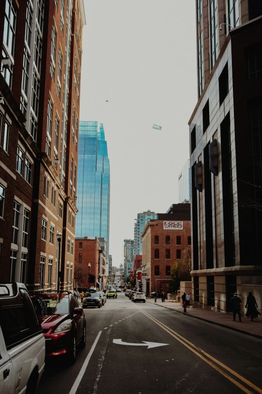 street with cars and tall buildings near city street