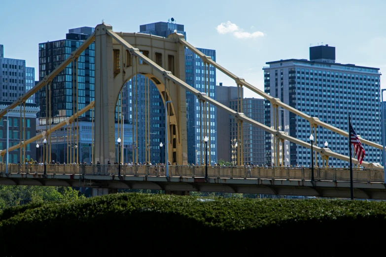 a bridge with tall buildings in the background
