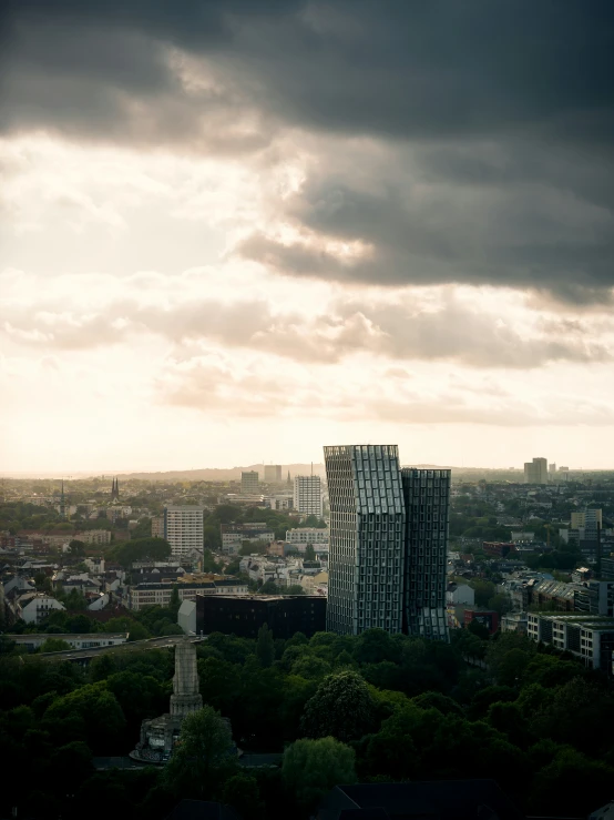 a tall building is standing in the middle of trees