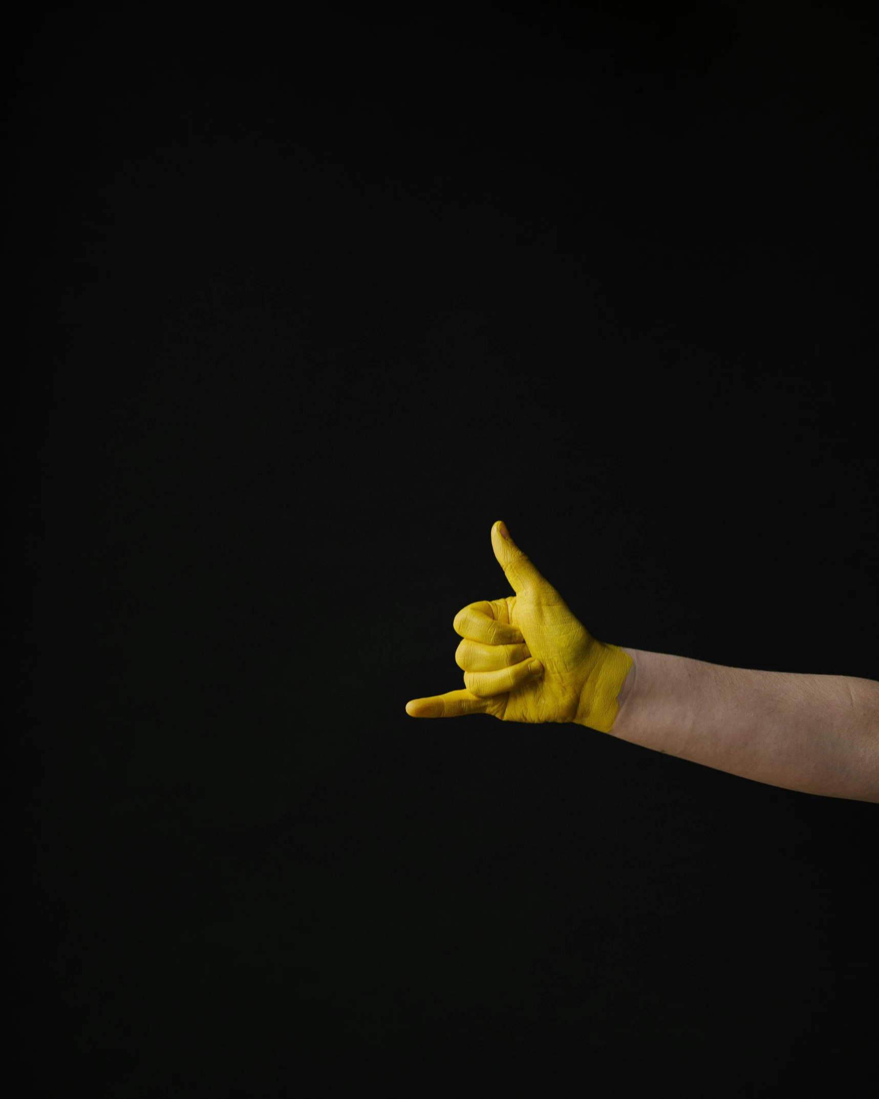 someone's hand with yellow powder on their arm