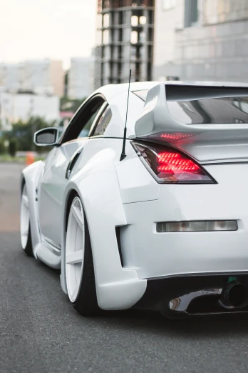 the back of a white modified sports car