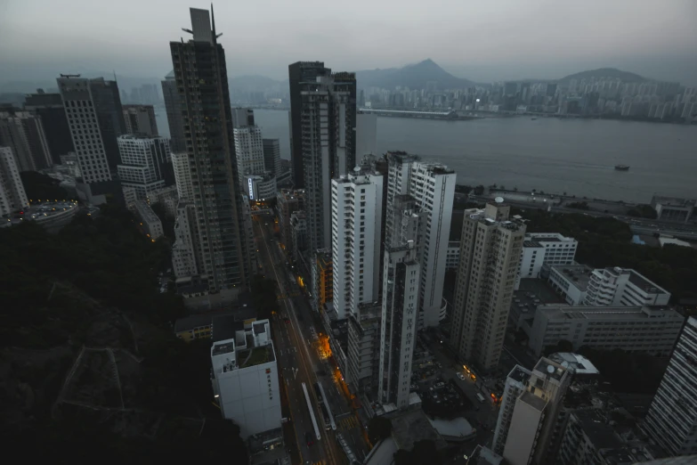 a street view of some big buildings by the water