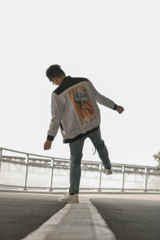 a boy on a skate board is walking over