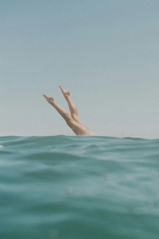 a person is diving out of the water