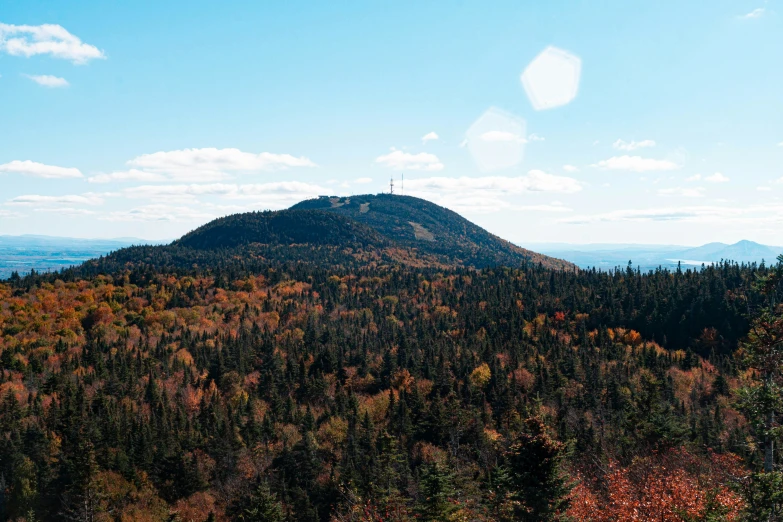 a scenic view of a mountain in autumn