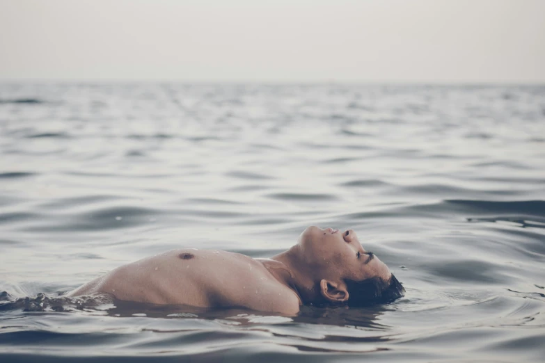 a man that is floating in some water