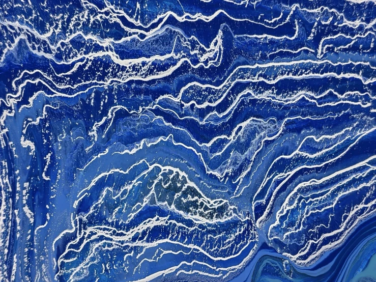 a painting that has blue and white designs on it