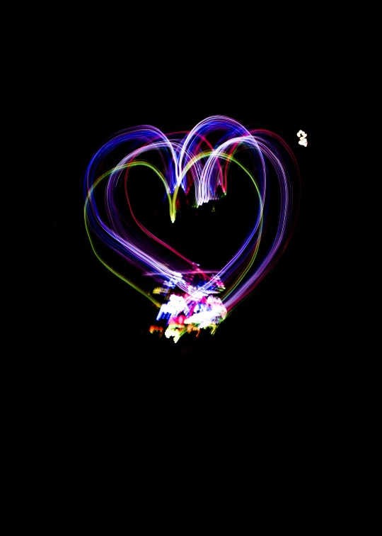 a very bright heart shape on the black background