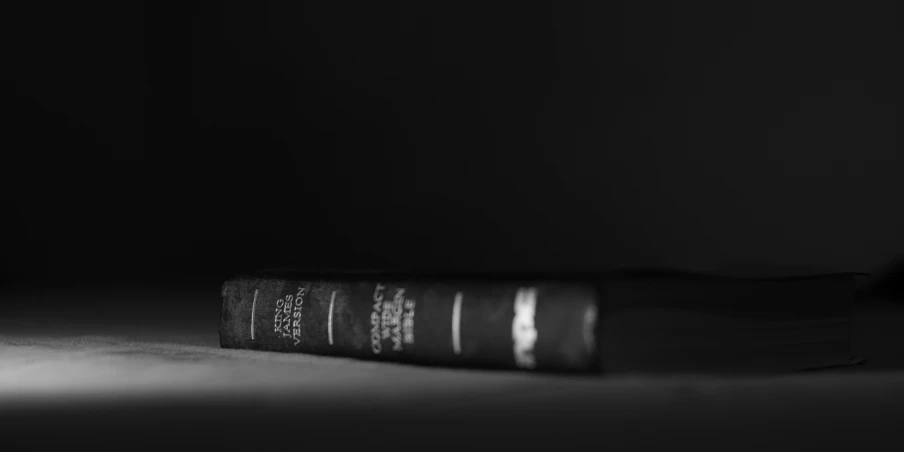 a black and white po of a book on the floor