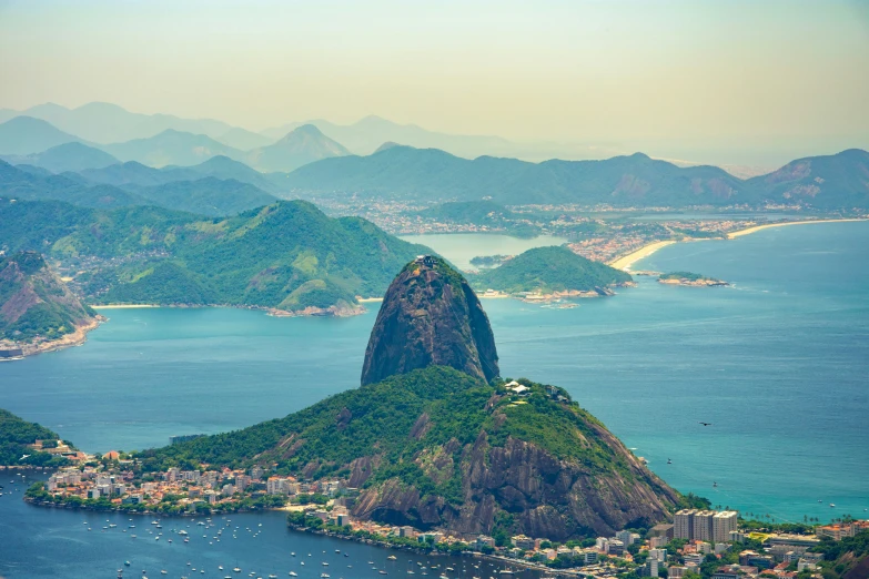 large mountain and harbor surrounded by small green islands