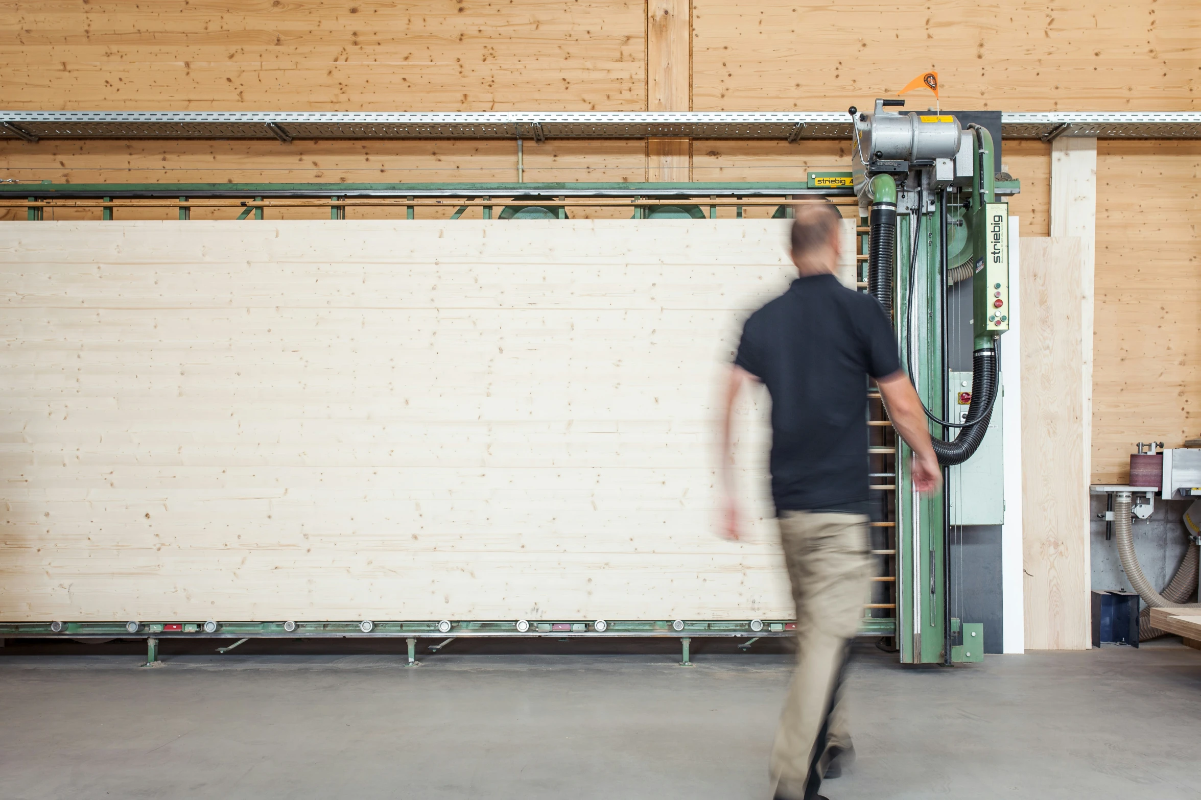 a man moving the pallet to place his feet on a rack