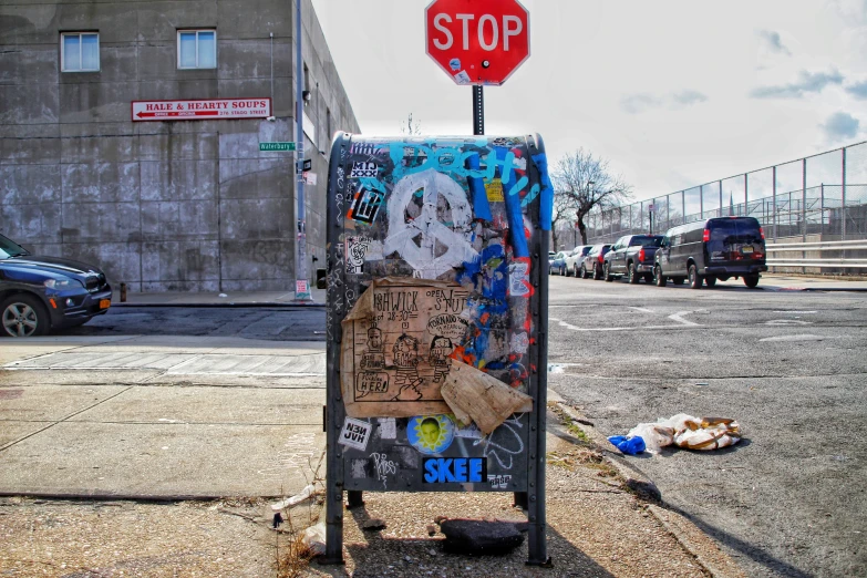 an assortment of stickers adorns a mail box